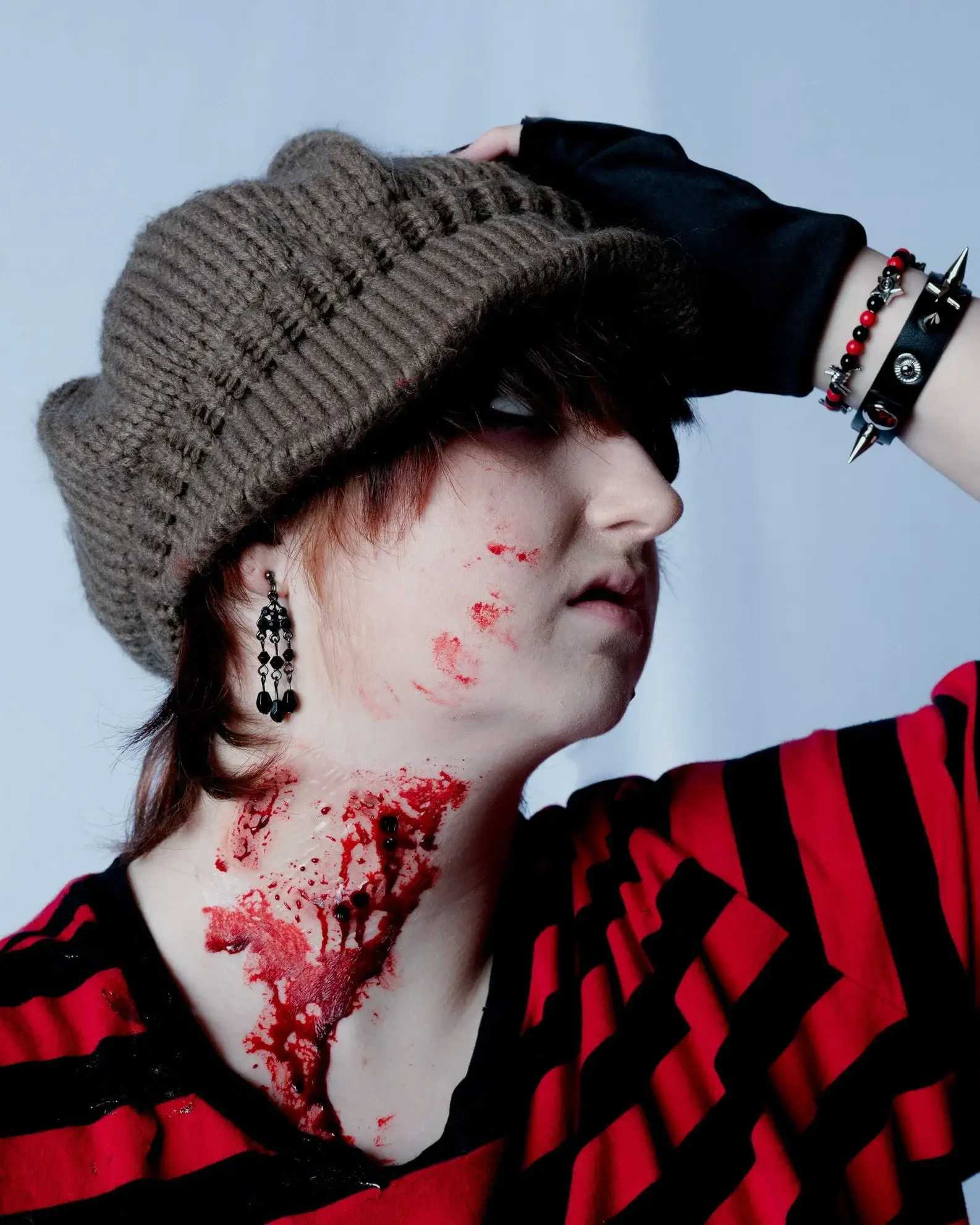 Torn, bloody vampire bite covering the side of a neck